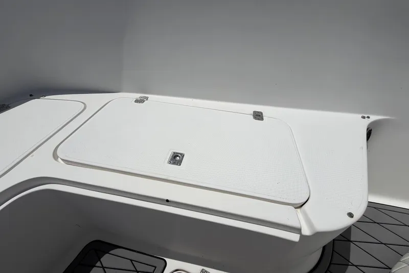 Slide: The Image of 2006 Pro Sports 2550 BW boat storage compartment with white hatch and hinges. - 39