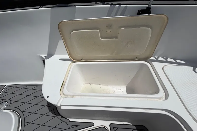 Slide: The Image of Open storage compartment on a 2006 Pro Sports 2550 BW boat deck. - 37