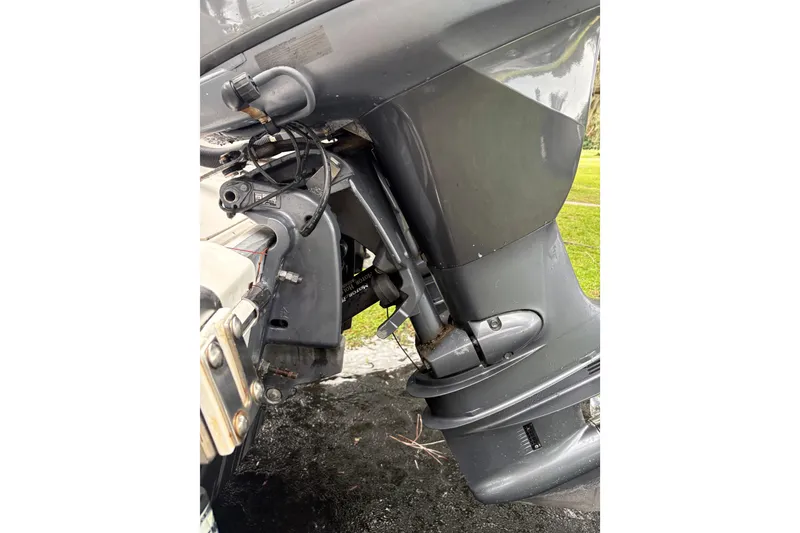 Slide: The Image of Close-up of a 2006 Pro Sports 2550 BW boat motor, showcasing mechanical details. - 21