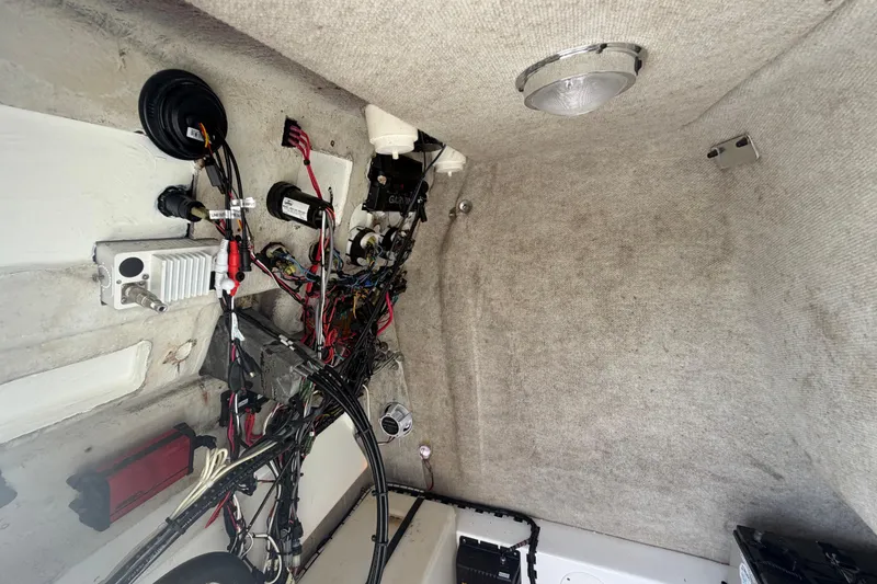 Slide: The Image of Interior wiring and components of a 2006 Pro Sports 2550 BW boat. - 53