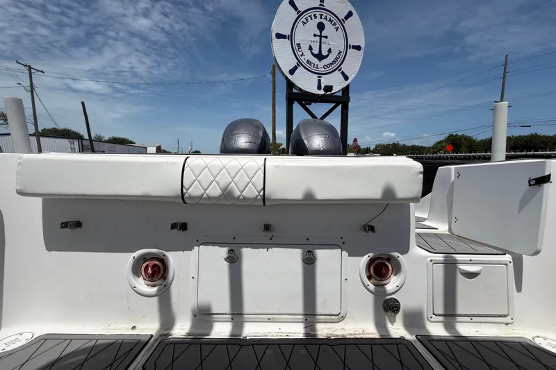 Slide: The Image of 2006 Pro Sports 2550 BW boat interior with dual engines and nautical decor. - 63