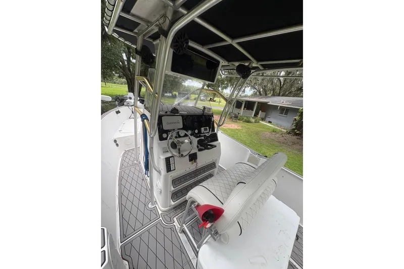 Slide: The Image of 2006 Pro Sports 2550 BW boat interior with steering console and seating. - 7