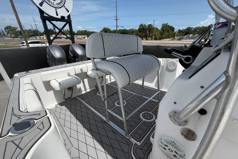 Slide: The Image of 2006 Pro Sports 2550 BW boat interior with dual engines and cushioned seating. - 58