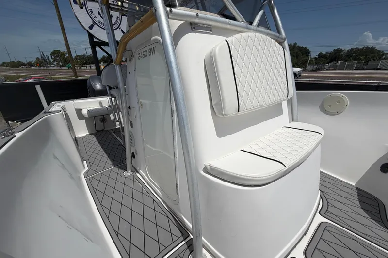 Slide: The Image of 2006 Pro Sports 2550 BW boat interior with cushioned seating and sleek design. - 51