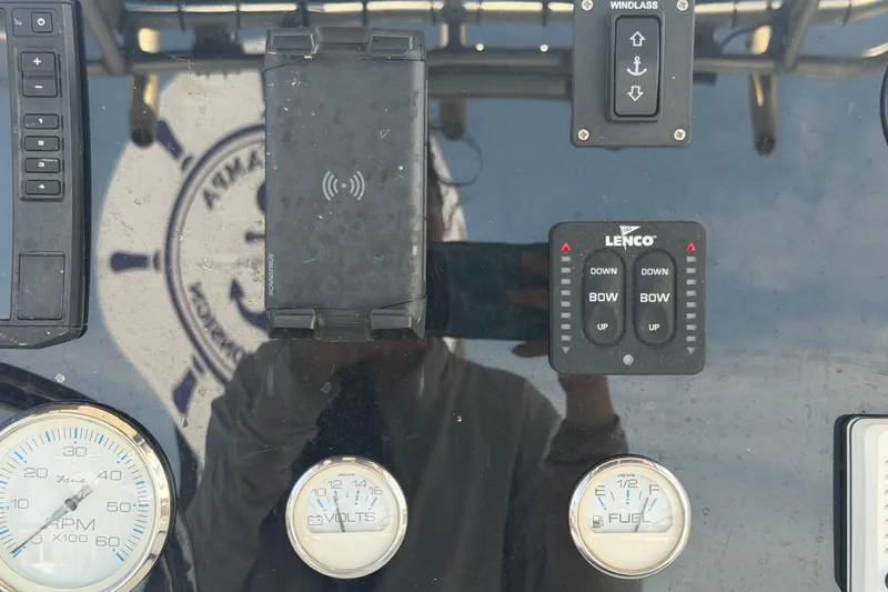 Slide: The Image of Control panel of a 2006 Pro Sports 2550 BW boat with gauges and switches. - 25