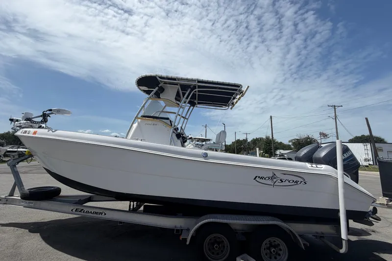 Slide: The Image of 2006 Pro Sports 2550 BW boat on trailer under clear sky. - 10