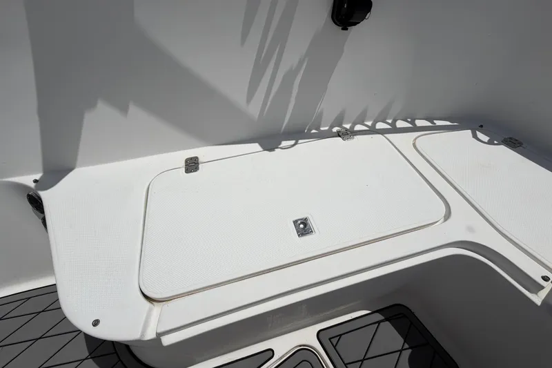 Slide: The Image of 2006 Pro Sports 2550 BW boat interior with storage compartments and clean white surfaces. - 36