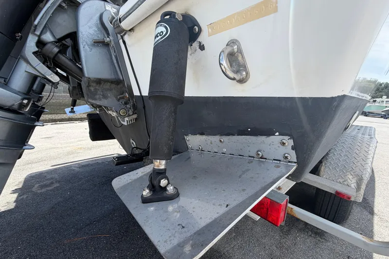 Slide: The Image of Close-up of a 2006 Pro Sports 2550 BW boat's stern and trim tab on a trailer. - 3