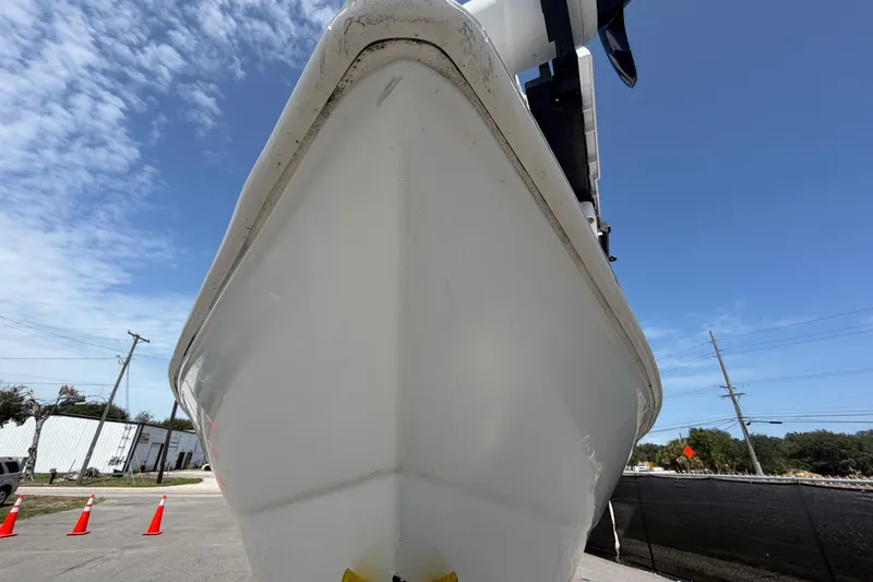 Slide: The Image of Bow view of a 2006 Pro Sports 2550 BW boat under clear blue sky. - 12