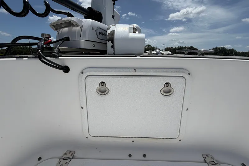 Slide: The Image of 2006 Pro Sports 2550 BW boat with Minn Kota trolling motor under a clear sky. - 43