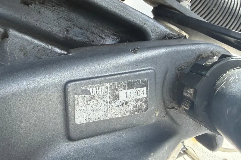 Slide: The Image of Close-up of a Pro Sports 2550 BW 2006 engine part with a worn label. - 76