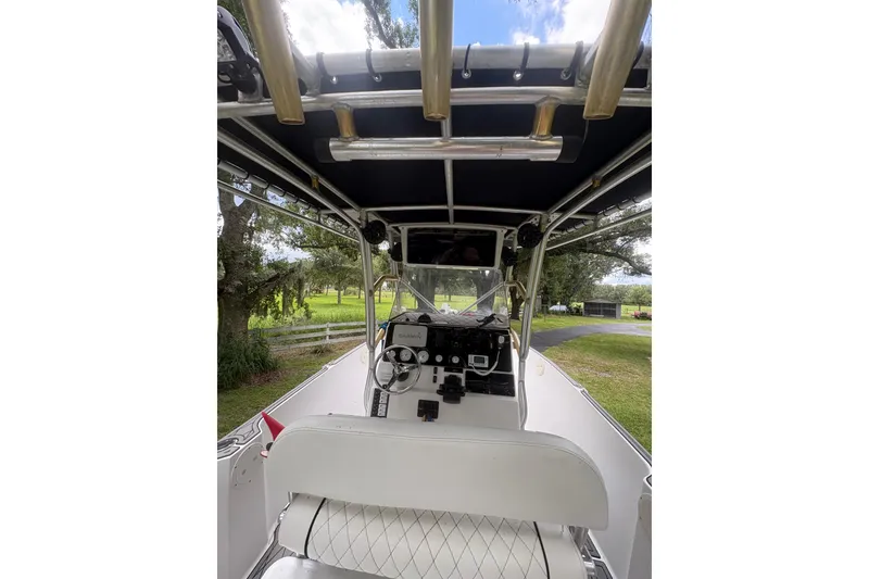 Slide: The Image of 2006 Pro Sports 2550 BW boat interior with steering console and canopy. - 6