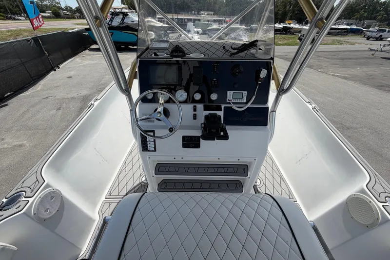Slide: The Image of 2006 Pro Sports 2550 BW boat cockpit with steering wheel and control panel. - 19