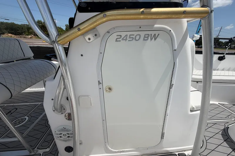 Slide: The Image of 2006 Pro Sports 2450 BW boat interior with seating and storage compartment. - 52