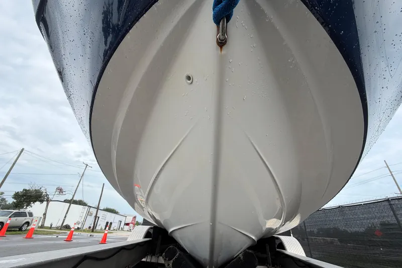 Slide: The Image of Close-up of the hull of a 2016 Yamaha 242 Limited S E-Series boat. - 10