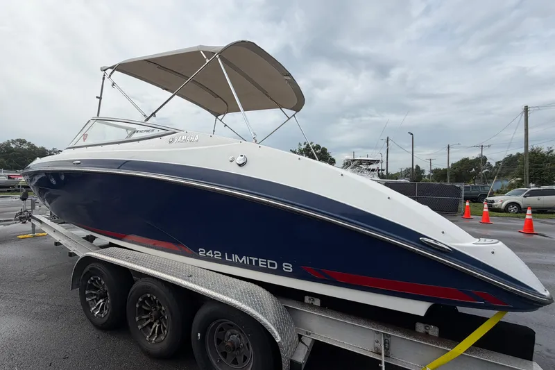 Slide: The Image of 2016 Yamaha Boats 242 Limited S E-Series on trailer, blue and white design. - 6