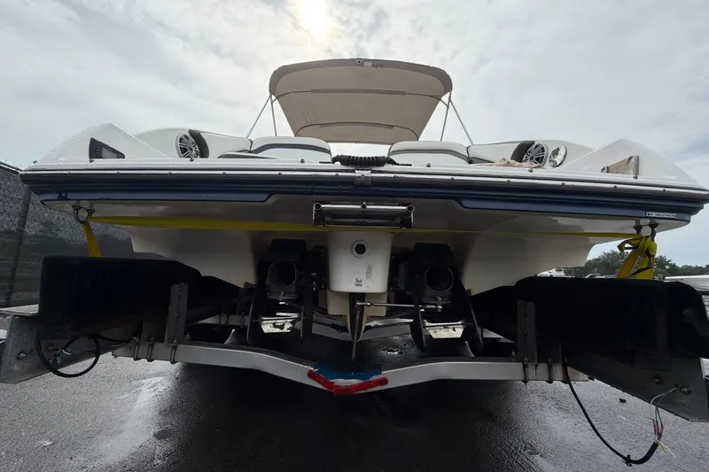 Slide: The Image of 2016 Yamaha Boats 242 Limited S E-Series on trailer, rear view, overcast sky. - 4
