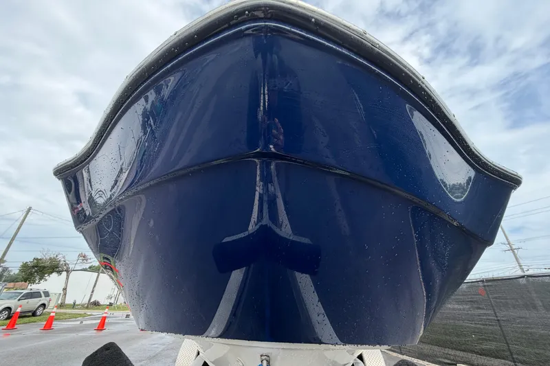 Slide: The Image of 2016 Yamaha Boats 242 Limited S E-Series, blue hull, close-up view. - 9