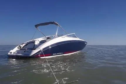 Slide: The Image of 2016 Yamaha Boats 242 Limited S E-Series on calm water under clear blue sky. - 8