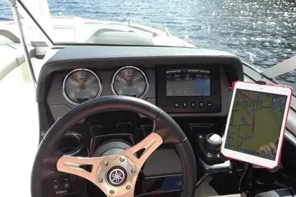 Slide: The Image of 2016 Yamaha Boats 242 Limited S E-Series dashboard with steering wheel and navigation display. - 15