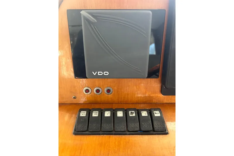 Slide: The Image of Control panel of a 2007 Legacy EXPRESS CRUISER with VDO display and switches. - 11