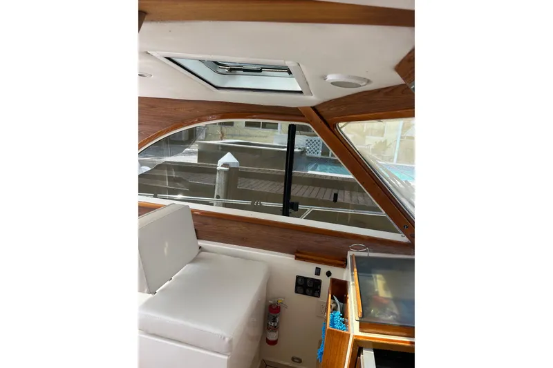 Slide: The Image of Interior of 2007 Legacy EXPRESS CRUISER with wood accents and seating. - 6