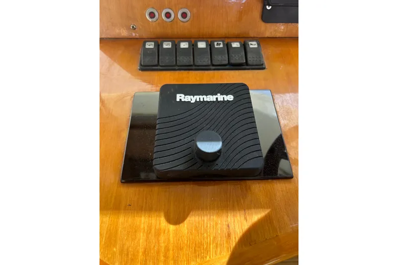 Slide: The Image of Raymarine control panel on 2007 Legacy EXPRESS CRUISER boat dashboard. - 12