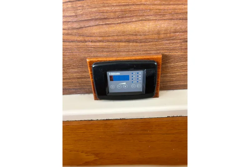 Slide: The Image of Control panel on 2007 Legacy EXPRESS CRUISER, mounted on wood-textured surface. - 17