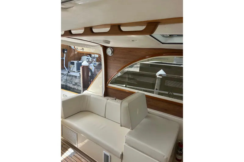 Slide: The Image of Interior of 2007 Legacy Express Cruiser with beige seating and wooden accents. - 5