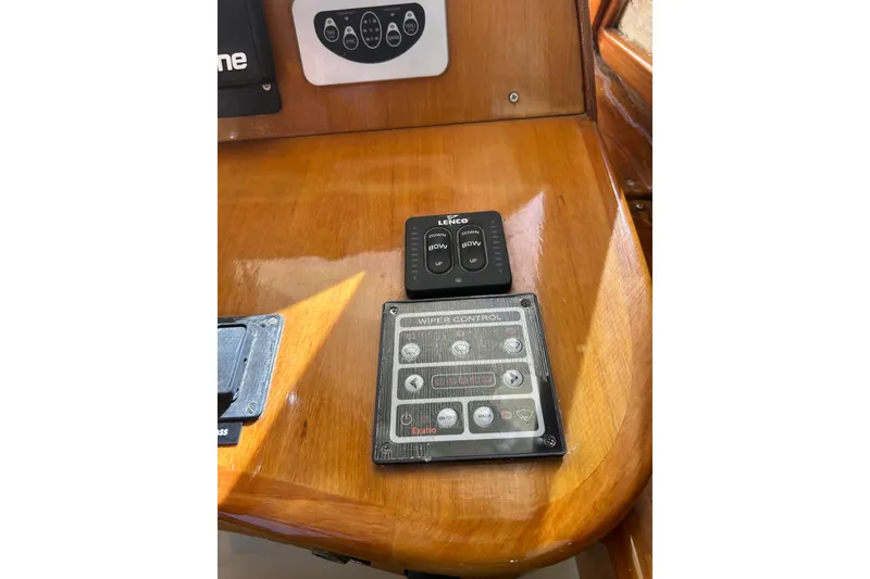 Slide: The Image of Control panel on 2007 Legacy EXPRESS CRUISER boat dashboard with Lenco and wiper controls. - 13