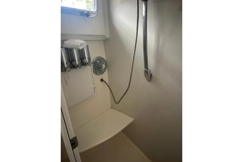 Slide: The Image of Compact shower area in 2007 Legacy EXPRESS CRUISER with dispensers and handheld showerhead. - 31