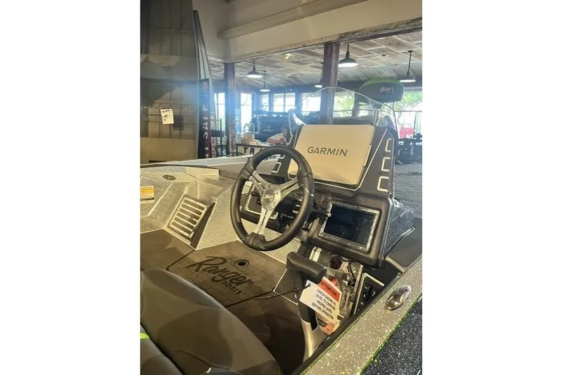 Slide: The Image of 2026 Ranger Z519R boat cockpit with Garmin navigation system and steering wheel. - 5