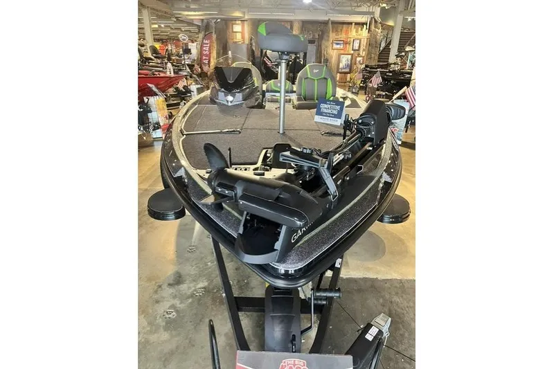 Slide: The Image of 2026 Ranger Z519R fishing boat displayed in showroom with advanced equipment. - 7