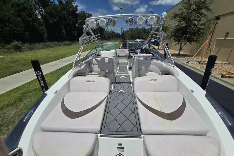 Slide: The Image of 2006 MasterCraft X-80 boat interior with plush seating and modern design. - 5
