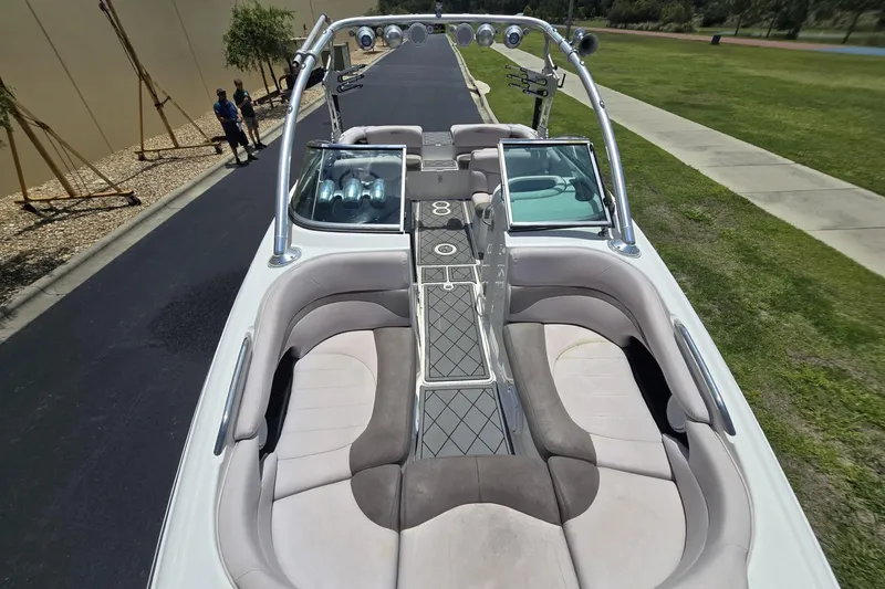 Slide: The Image of 2006 MasterCraft X-80 boat with spacious seating and sleek design on a sunny day. - 4