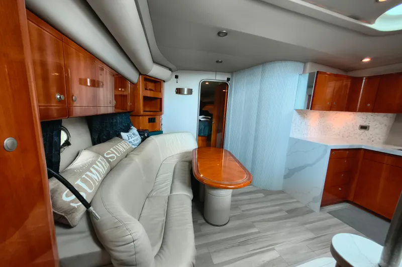 Slide: The Image of Luxurious interior of a 2005 Formula 48 Yacht with elegant wood finishes and modern design. - 14