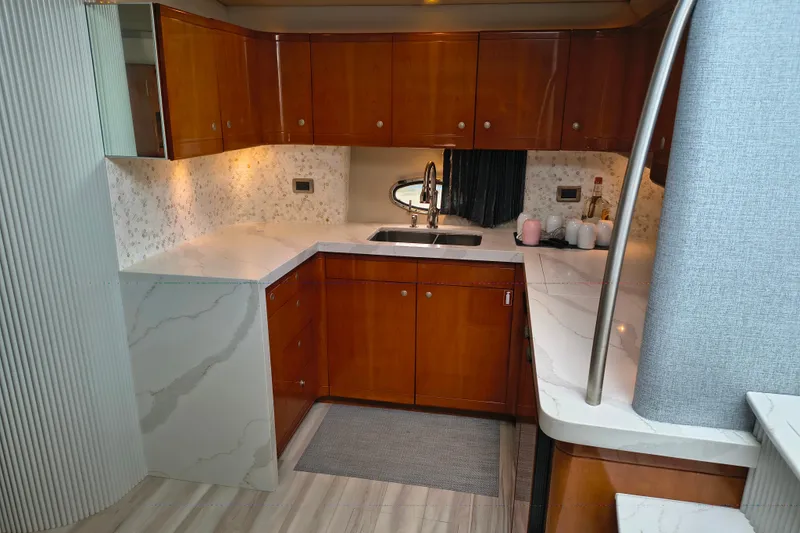 Slide: The Image of Luxurious kitchen interior of 2005 Formula 48 Yacht with modern cabinetry and marble countertops. - 16