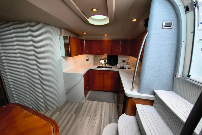 Slide: The Image of Luxurious interior of a 2005 Formula 48 Yacht with modern kitchen design. - 15