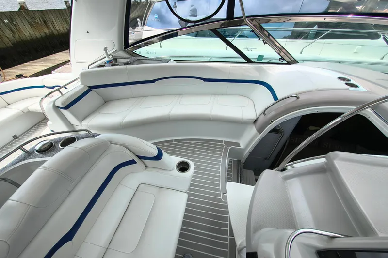 Slide: The Image of Luxurious interior of a 2005 Formula 48 Yacht with white seating and sleek design. - 6