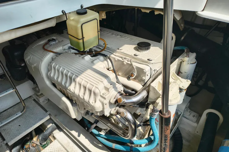 Slide: The Image of Engine compartment of a 2005 Formula 48 Yacht, showcasing detailed mechanical components. - 24
