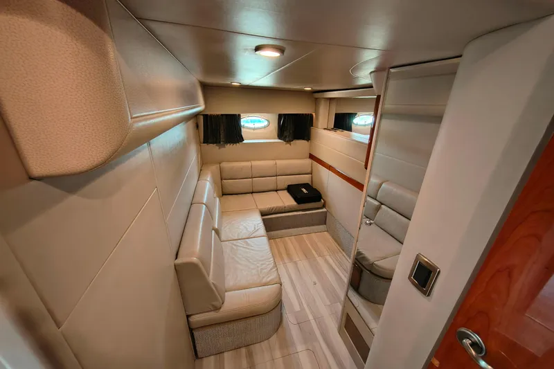 Slide: The Image of Interior of 2005 Formula 48 Yacht with beige seating and wood accents. - 19