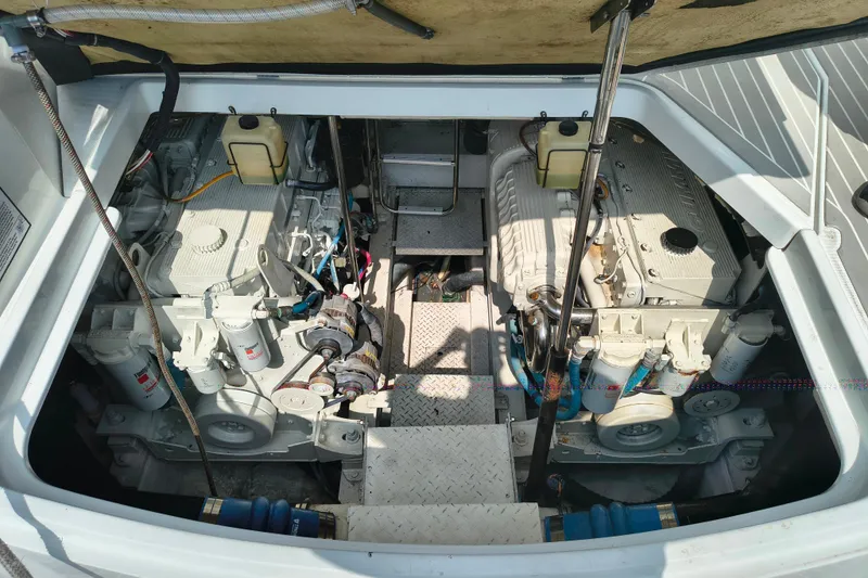 Slide: The Image of Engine compartment of a 2005 Formula 48 Yacht, showcasing dual engines and mechanical components. - 22