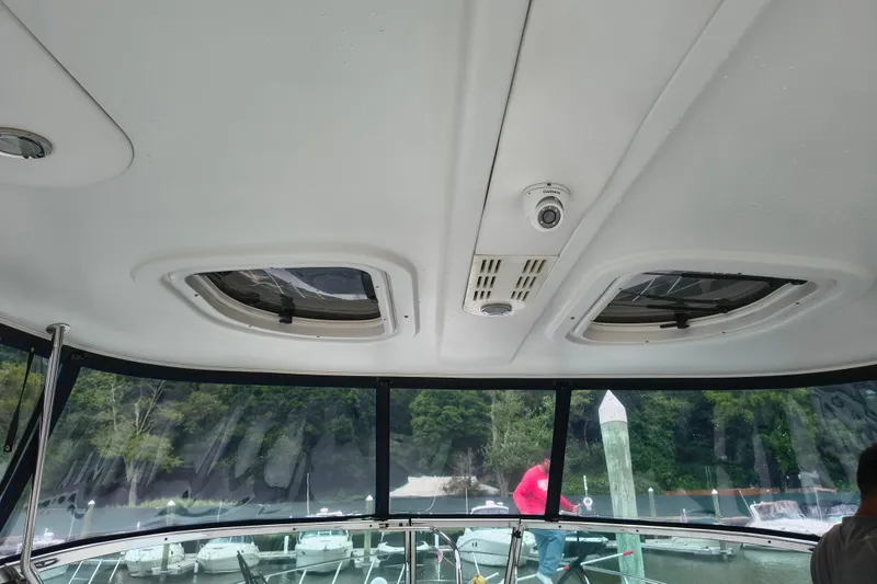 Slide: The Image of Interior view of 2005 Formula 48 Yacht with marina backdrop. - 12