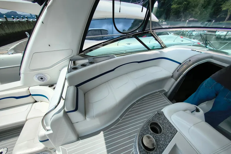 Slide: The Image of Interior of a 2005 Formula 48 Yacht with white seating and cup holders. - 5