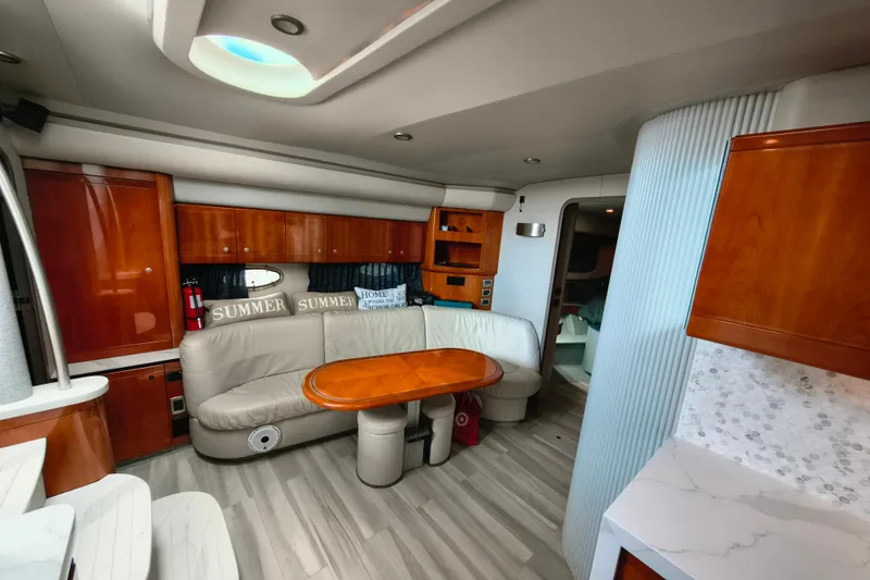 Slide: The Image of Luxurious interior of a 2005 Formula 48 Yacht with elegant wood finishes and cozy seating. - 13