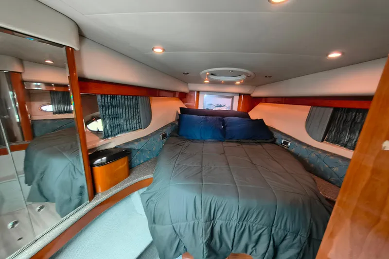 Slide: The Image of Luxurious bedroom interior of 2005 Formula 48 Yacht with cozy bedding and elegant wood finishes. - 17