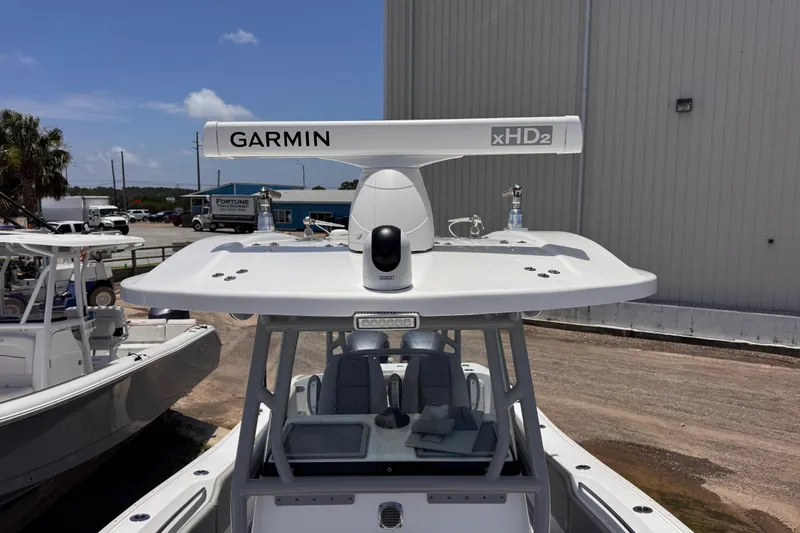 Slide: The Image of 2020 Cape Horn 32XS boat with Garmin xHD2 radar system, docked outdoors. - 16