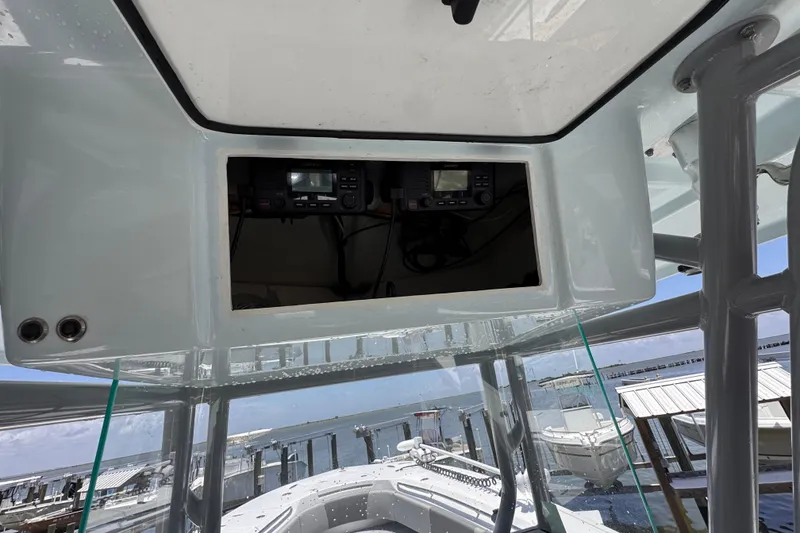 Slide: The Image of 2020 Cape Horn 32XS boat console with electronic equipment, docked at marina. - 12