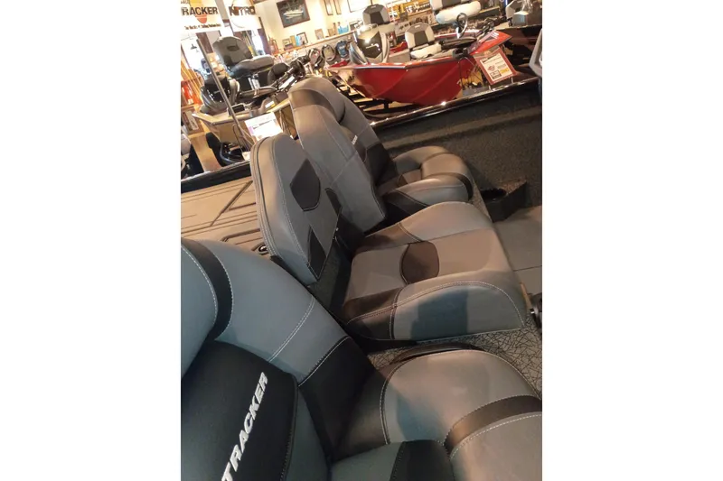Slide: The Image of 2026 Tracker Savage 215 boat interior with sleek, modern seating design. - 15