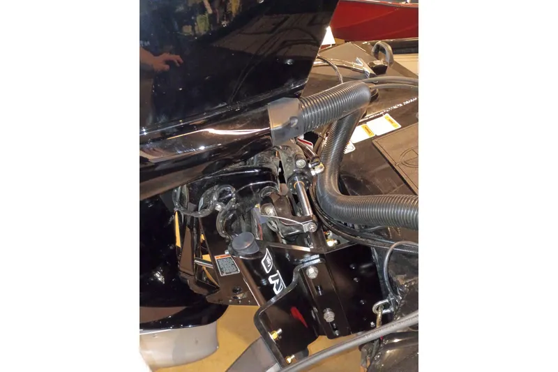 Slide: The Image of Close-up of 2026 Tracker Savage 215 boat engine components and wiring. - 14
